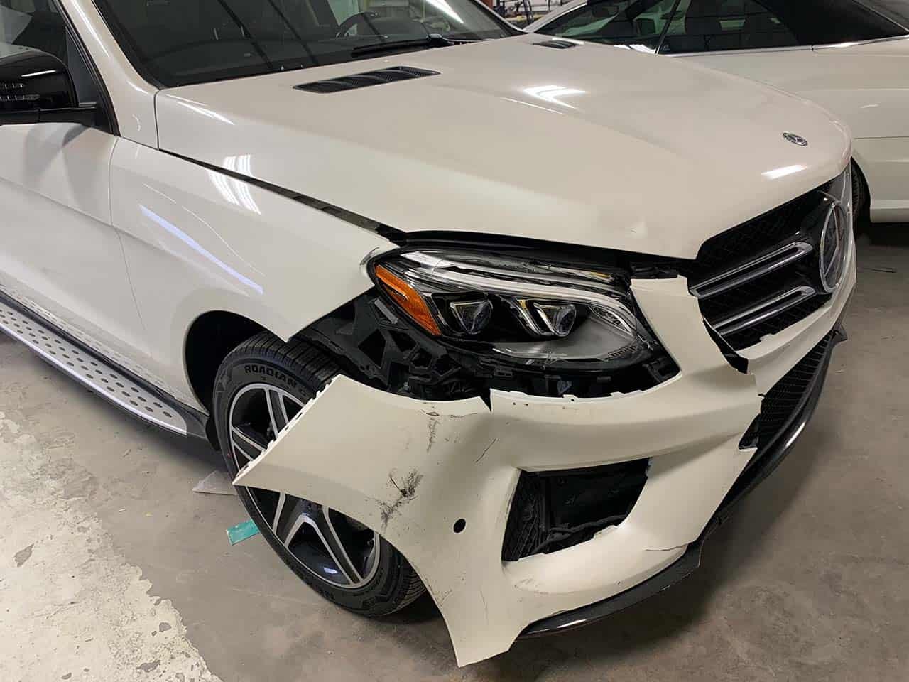 White Mercedes Before Auto Body Repair